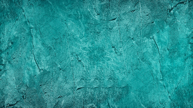 Blue green abstract background. Toned rough rock surface texture. Beautiful teal background with copy space for design.