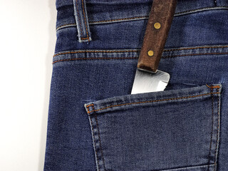 Knife in your pants pocket. Killer concept. Crime by white weapon.