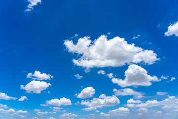 Beautiful blue sky with white cumulus clouds floating