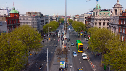 Naklejka premium Famous O Connell Street with Spire in Dublin from above - aerial view by drone