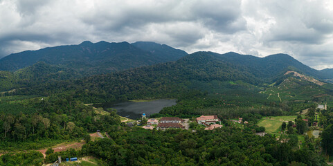 Fototapeta premium Aerial drone view of rural scenery with tropical trees in Mount Ledang National Park, Johor, Malaysia.