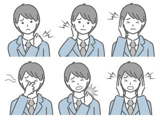 色々な部分が痛むスーツの若い男性