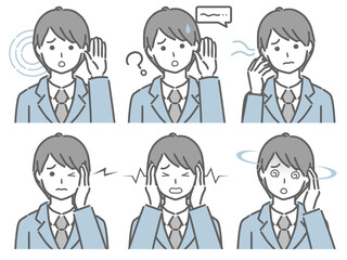 耳の調子が悪いスーツの若い男性