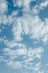 Beautiful blue sky background with fluffy clouds