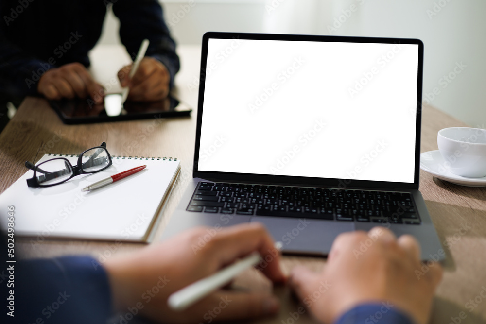 Poster mockup blank screen computer man using laptop on desk in office laptop with blank copy space screen 
