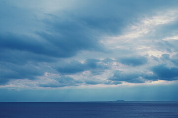 dark blue sea background, moody sky