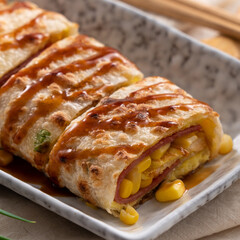 Delicious Taiwanese omelette, egg pancake roll with ham and corn kernels.