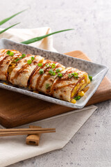 Delicious Taiwanese omelette, egg pancake roll with ham and corn kernels.
