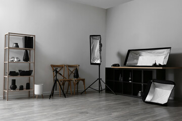 Interior of stylish photo studio with modern equipment