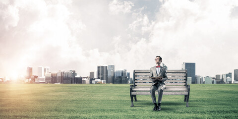 Young businessman or student studying the science and cityscape at background