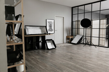 Different professional equipment in stylish photo studio interior