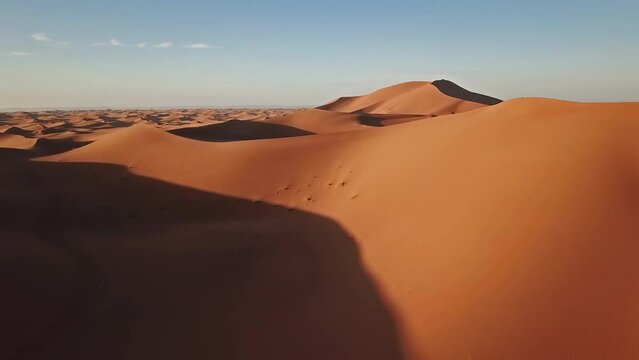 Aerial view on big sand dunes in Sahara desert at sunrise, Africa, 4k