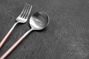 Fork and spoon on dark background