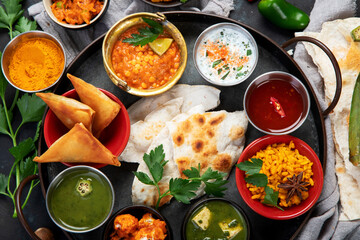 Indian Thali on dark background.