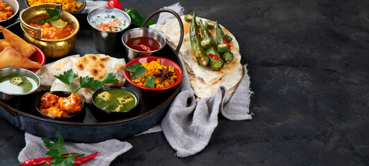Indian Thali on dark background.