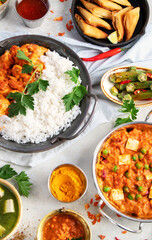 Indian food assortment on light background.