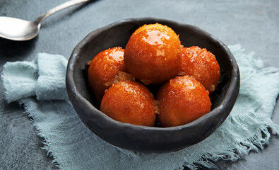 Gulab Jamun on gray background.