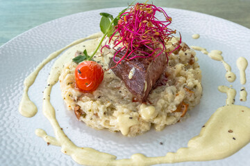 Demi magret de canard sur risotto aux champignons 