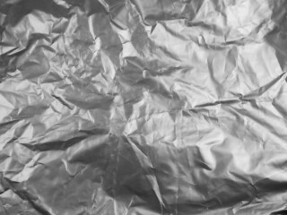 The surface of a used black plastic bag is crumpled into a garbage bag. We will take advantage of the crumpled and uneven surfaces.