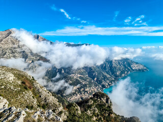 Panoramic view from Monte Comune on coastal town Positano, Praiano appearing from clouds. Magical...
