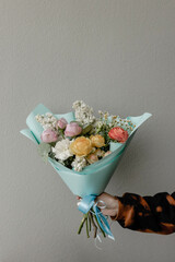 Bright delicate bouquet on a gray background