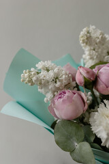 Bright delicate bouquet on a gray background