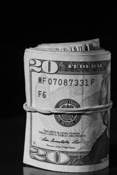 twisted stack of twenty-dollar American dollar banknotes