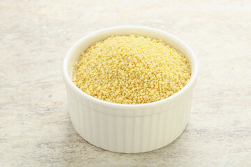 Raw couscous in the bowl