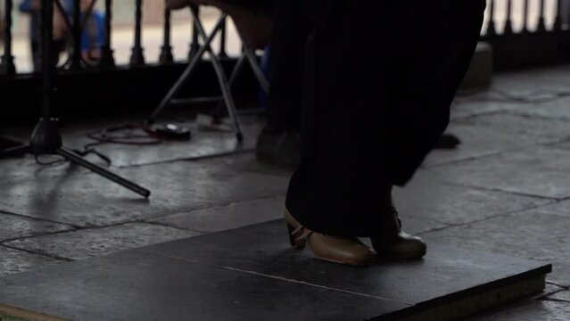 Close up of female flamenco dancer feet dancing in slow motion
