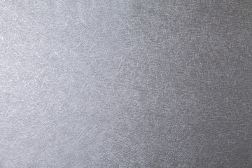 Silver abstract rough scratch background with copy space for design.