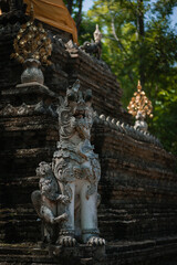 Fototapeta na wymiar Mythological creatures statue at Wat Palad or Wat Pha Lat temple the secret hidden temples nestled in the jungle is the travel destination of Chiang Mai, Thailand.