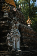 Fototapeta na wymiar Mythological creatures statue at Wat Palad or Wat Pha Lat temple the secret hidden temples nestled in the jungle is the travel destination of Chiang Mai, Thailand.