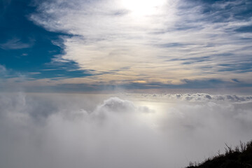 Naklejka na ściany i meble Panoramic sea view from Monte Comune on thick white clouds and blue sky near the coastal town Positano. Magical hiking above fog in Lattari Mountains, Apennines, Amalfi Coast, Campania, Italy, Europe