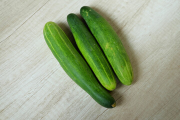 cucumbers on a wooden board
