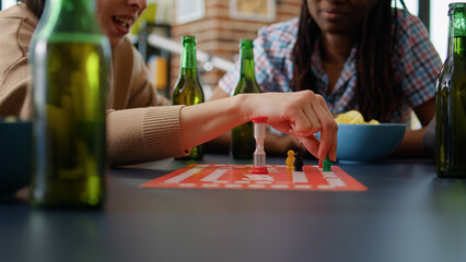 Diverse group of friends playing charades board games and fun gathering, enjoying leisure activity...