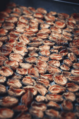 The process of home cooking dried fruits in an electric dryer.