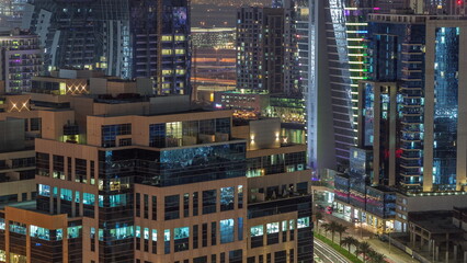 Fototapeta na wymiar Bay Square district night timelapse with mixed use and low rise complex office buildings located in Business Bay in Dubai