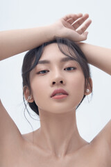 Naklejka premium Beauty portrait of Asian female face with natural skin on white background