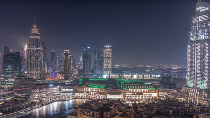 Naklejka premium Aerial view of Dubai International Financial Centre district night timelapse