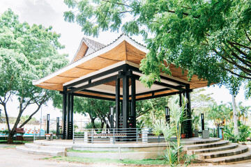 Fototapeta na wymiar A Chinese-style kiosk surrounded by trees, A park with a Japanese-style kiosk, concept of a small Japanese temple