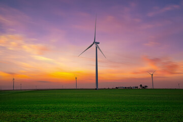 Fototapeta na wymiar Beautiful windmill turbine at sunset,