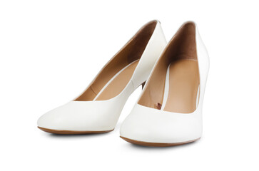 Classic snow-white bride shoes made of genuine leather with high elegant heels, isolated on a white background.