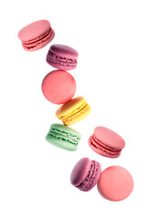 Sweet macaroons falling on white backgrounds.