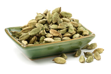 Green cardamom pods on white background