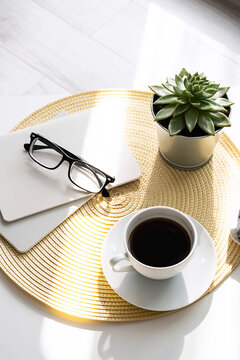 Office desk with coffee cup, succulent plant, eyeglasses and notepad. Minimal style image of business table.