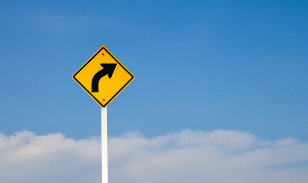 Traffic sign: warning sign on the right curve means the way ahead is a right curve.