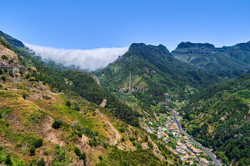 Fototapeta na wymiar Beautiful madeira mountains with flowing clouds