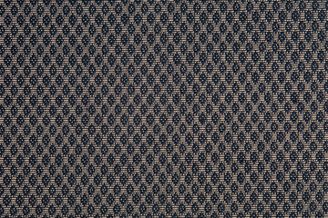 Knitted texture. Texture of jacquard fabric with gray geometric pattern. Crochet mosaic pattern