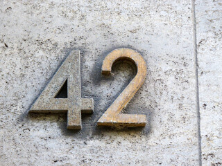 Metal home number on a wall