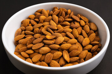 almonds (badam) in white bowl